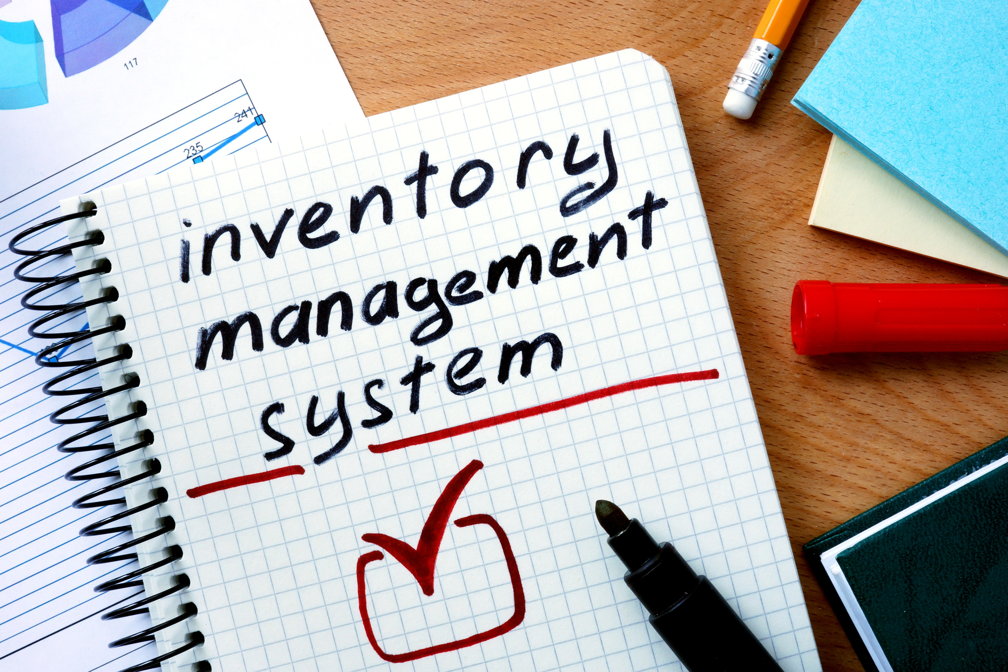 inventory management system written on a notepad