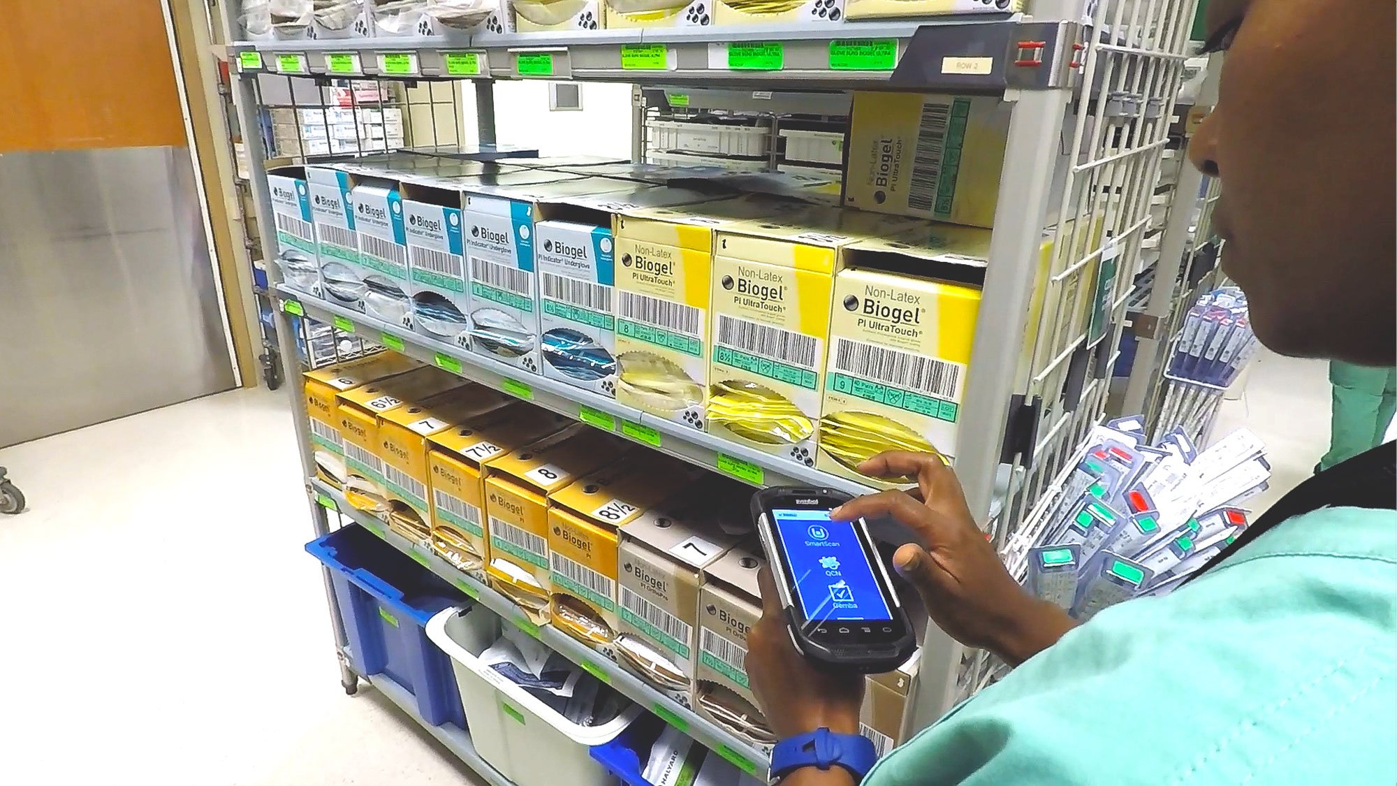 supply chain worker scanning supplies with SmartScan handheld