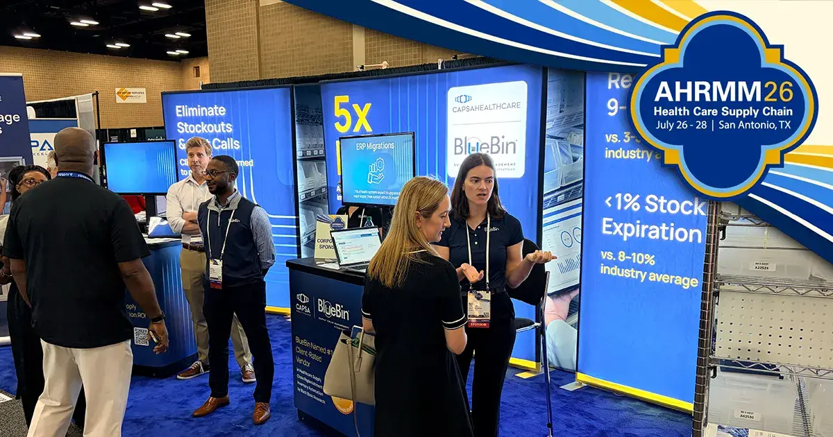 BlueBin team speaking with visitors at AHRMM26