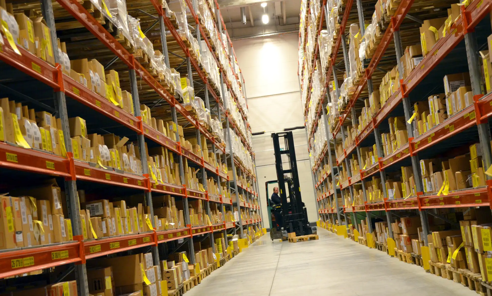 forklift in warehouse aisle